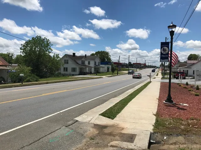 a view of a yard with yellow lighting