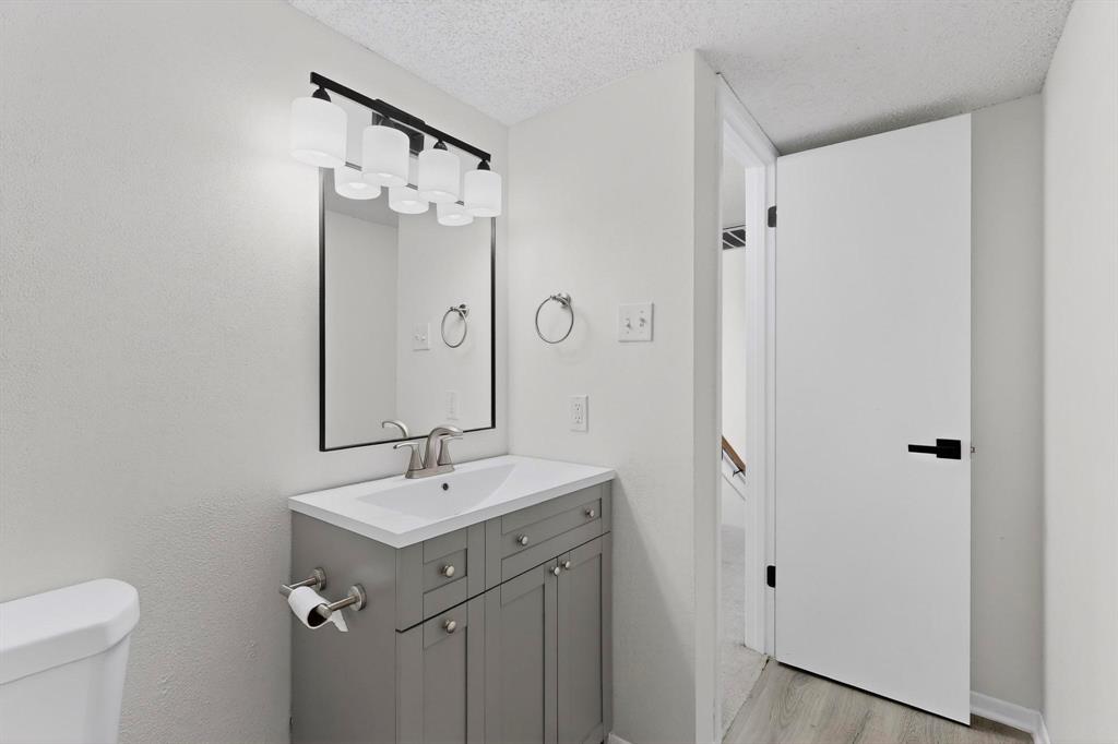 2018 Warnford Place Arlington, TX 76015 - Photo 12 of 34 a bathroom with a double vanity sink mirror and toilet