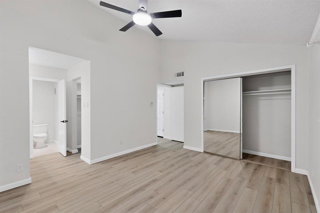 2018 Warnford Place Arlington, TX 76015 - Photo 14 of 34 an empty room with wooden floor and windows