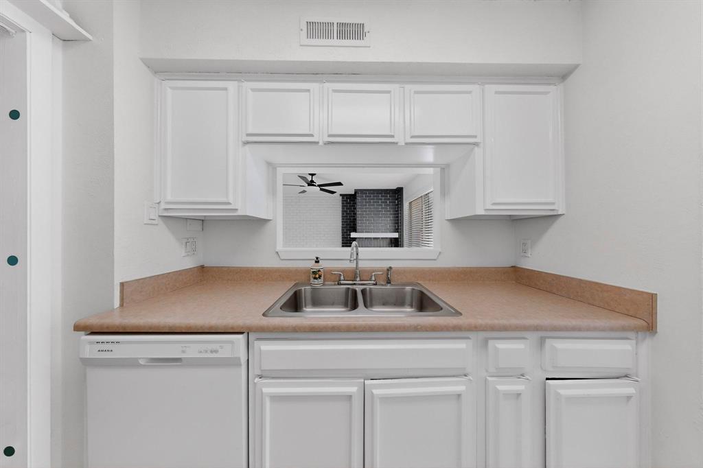 2018 Warnford Place Arlington, TX 76015 - Photo 6 of 34 a kitchen with cabinets a sink and dishwasher