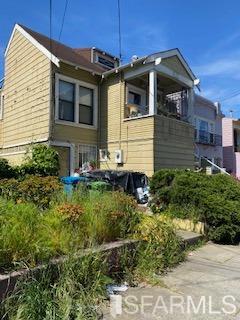 120 Rolph Street San Francisco, CA 94112 - Photo 2 of 6 a front view of a house with a yard