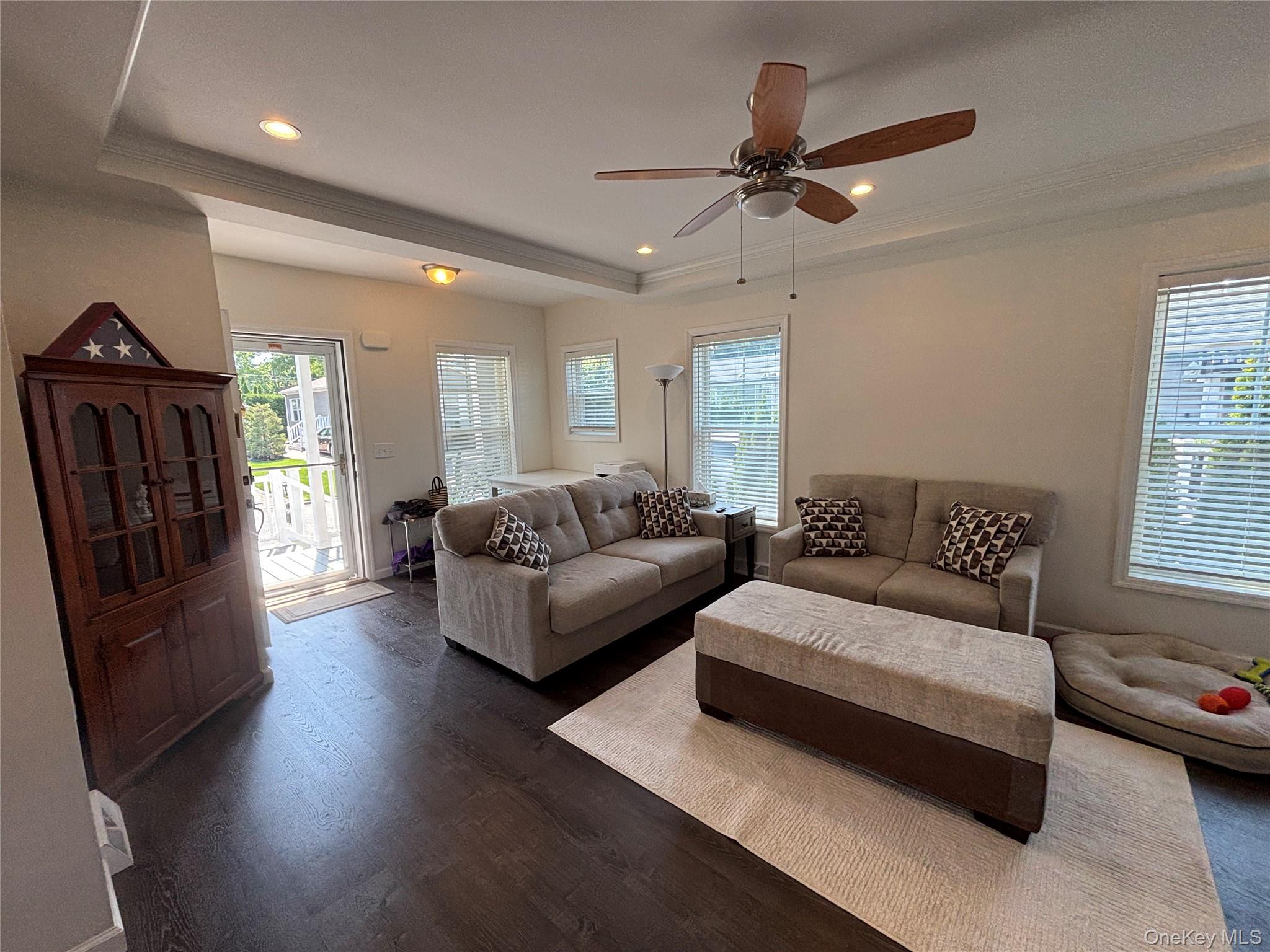1661 Old Country Road, Unit 563 Riverhead, NY 11901 - Photo 10 of 43 a living room with furniture window and a ceiling fan