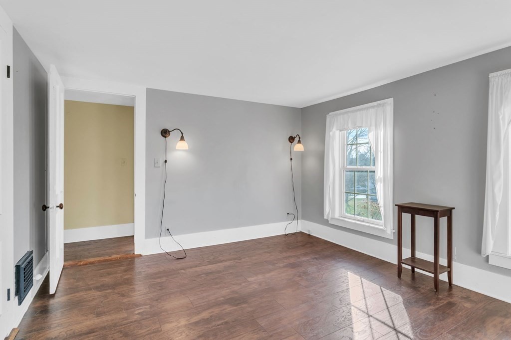 9 N Road Westfield, MA 01085 - Photo 29 of 42 an empty room with wooden floor and windows