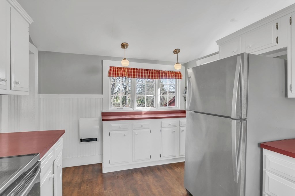 9 N Road Westfield, MA 01085 - Photo 6 of 42 a kitchen with a refrigerator and a stove top oven