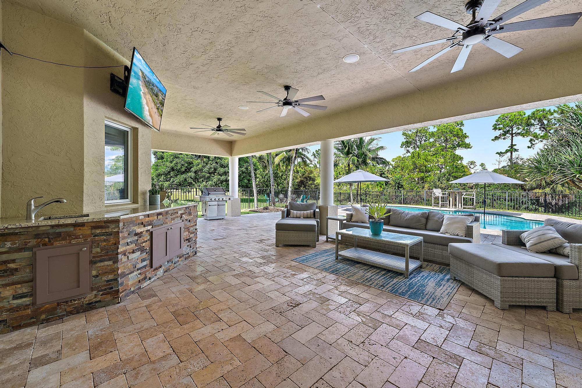 15847 86th Road North Loxahatchee, FL 33470 - Photo 33 of 45 a living room with furniture and a large window