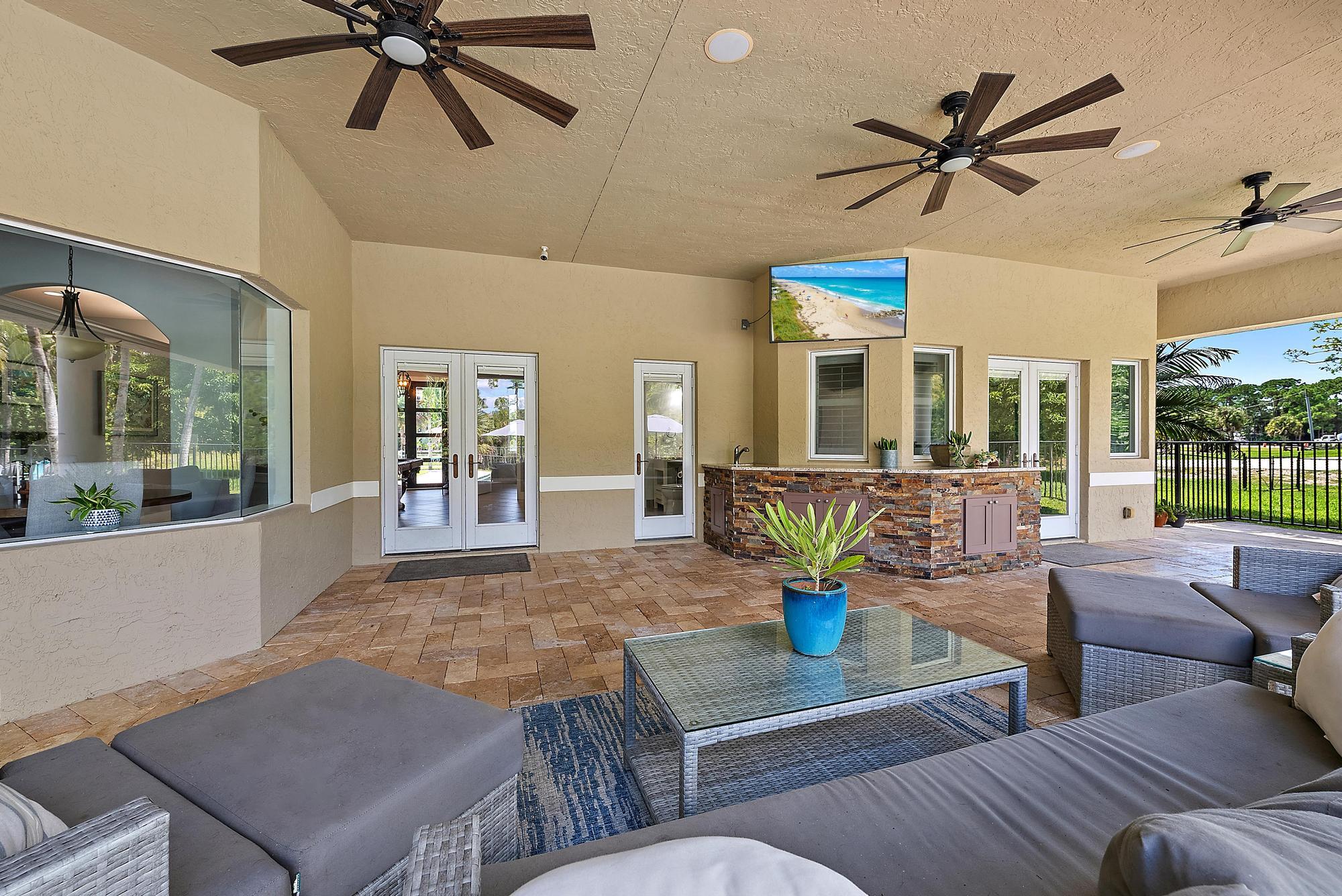 15847 86th Road North Loxahatchee, FL 33470 - Photo 35 of 45 a living room with furniture kitchen view and a large window