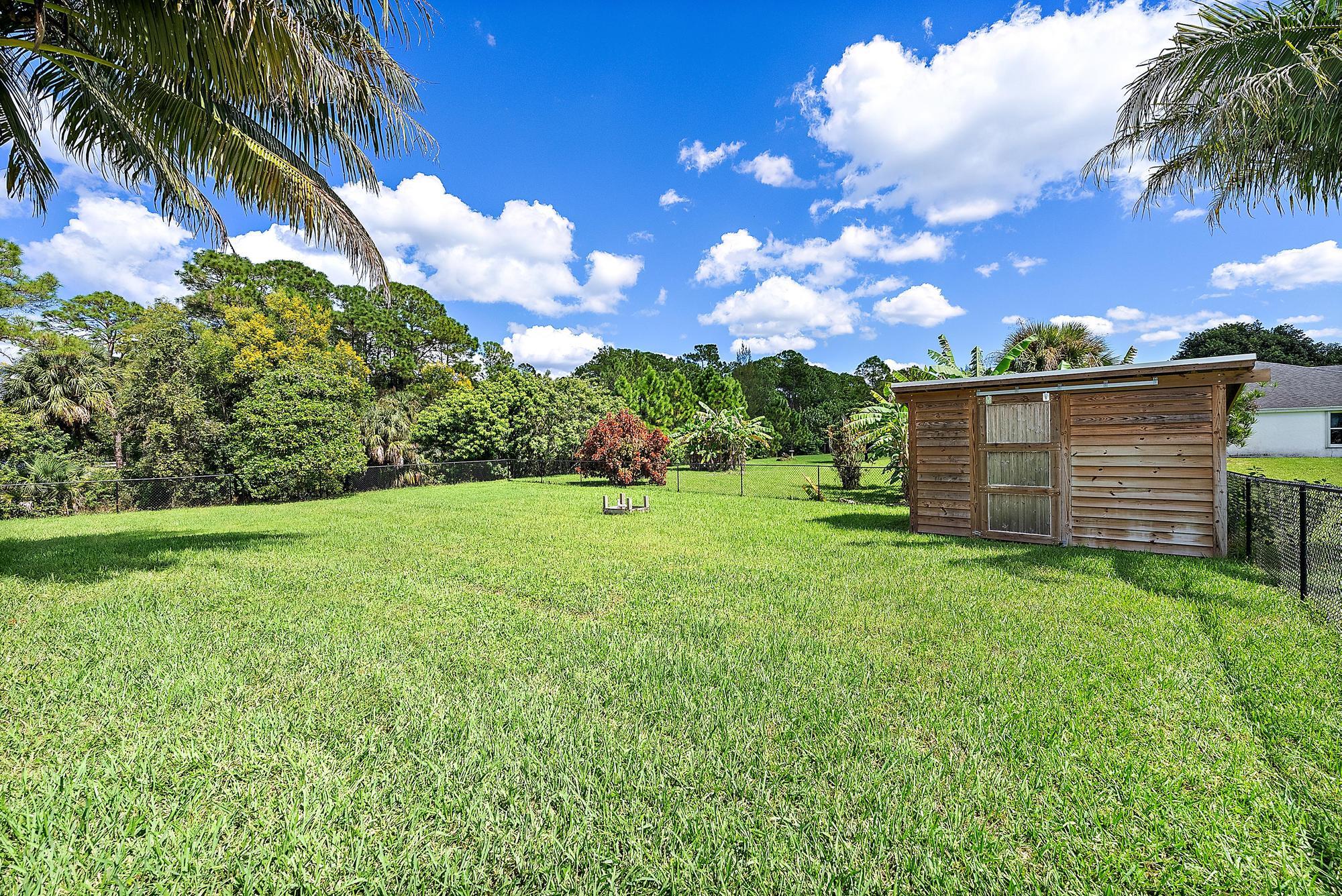 15847 86th Road North Loxahatchee, FL 33470 - Photo 40 of 45 a view of a backyard with garden