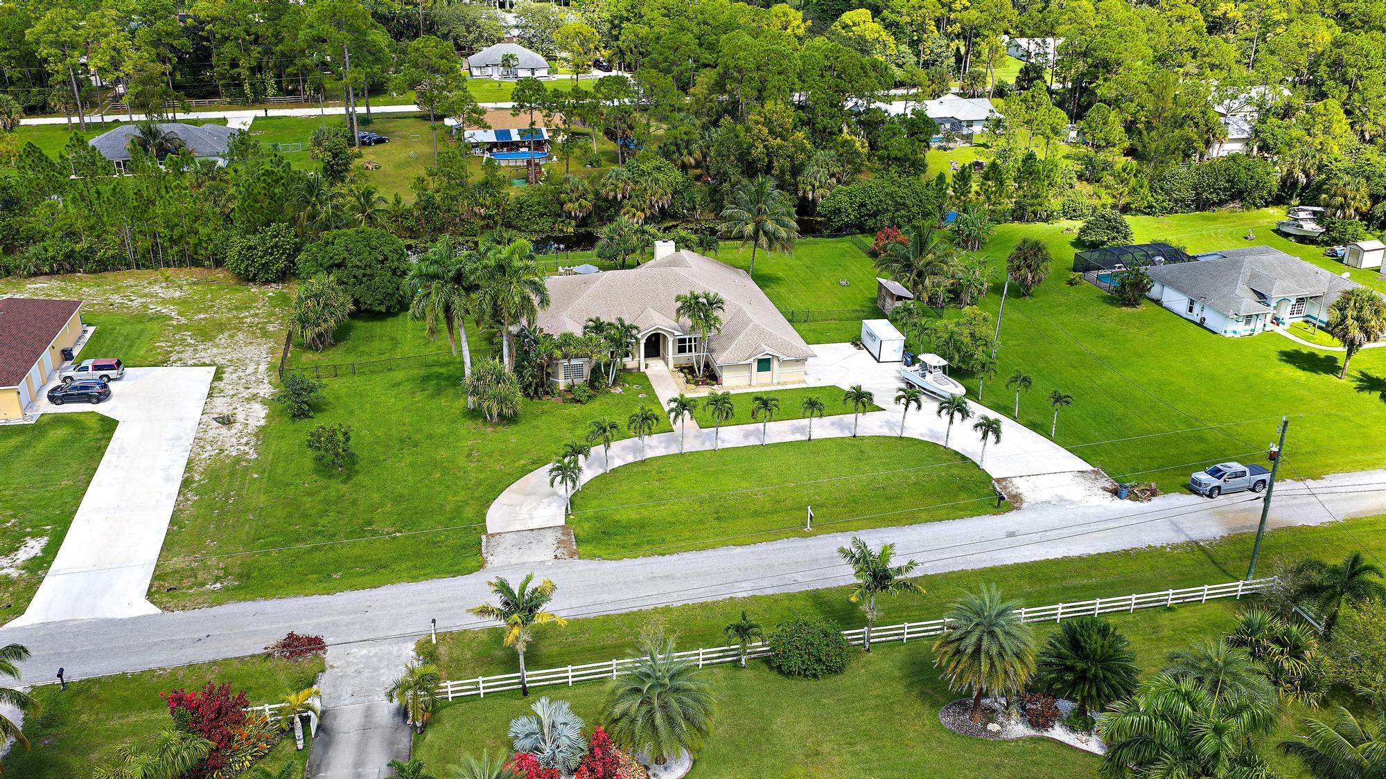 15847 86th Road North Loxahatchee, FL 33470 - Photo 42 of 45 an aerial view of a house
