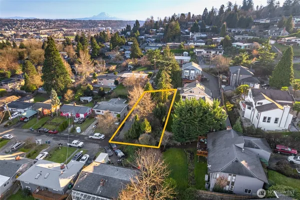 an aerial view of houses with outdoor space