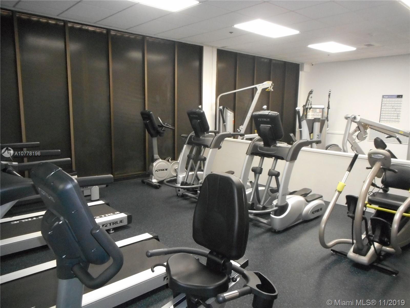 9511 Collins Avenue, Unit 1209 Surfside, FL 33154 - Photo 13 of 20 a room with gym equipment