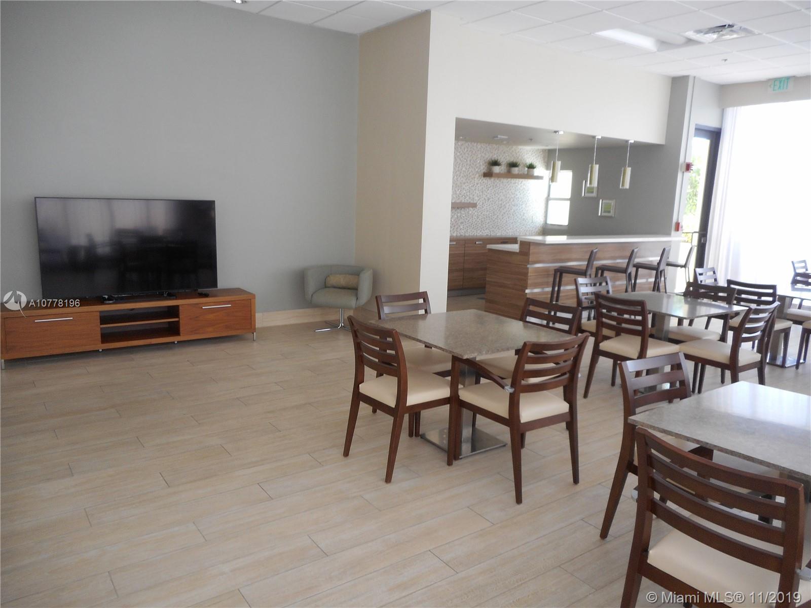 9511 Collins Avenue, Unit 1209 Surfside, FL 33154 - Photo 16 of 20 a view of a livingroom with furniture