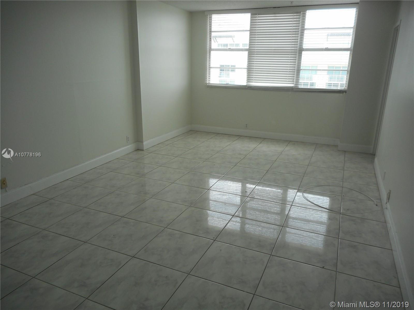 9511 Collins Avenue, Unit 1209 Surfside, FL 33154 - Photo 8 of 20 a view of an empty room with a window