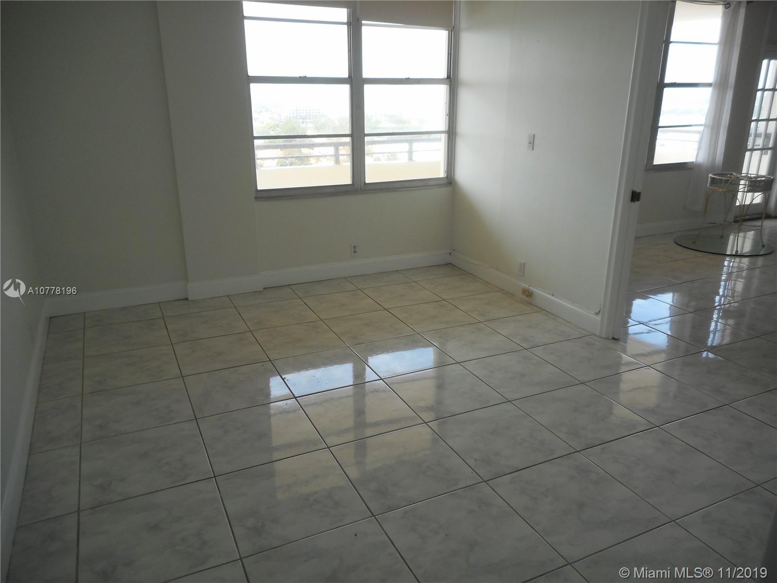9511 Collins Avenue, Unit 1209 Surfside, FL 33154 - Photo 9 of 20 a view of an empty room with a window