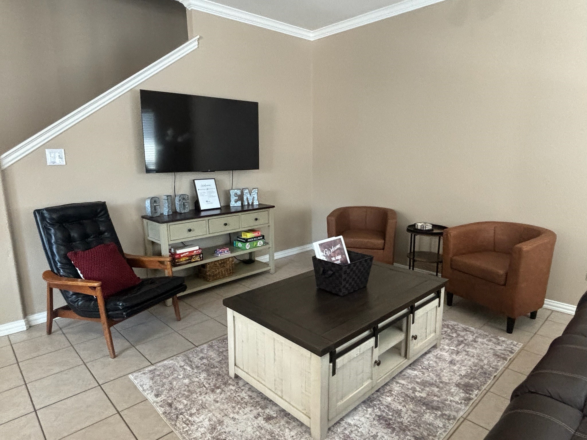a living room with furniture and a flat screen tv