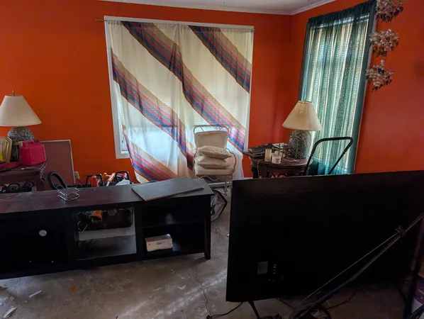 a view of an chairs and table in the room
