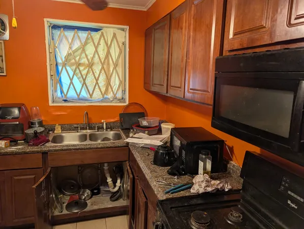 a kitchen with a stove and a microwave