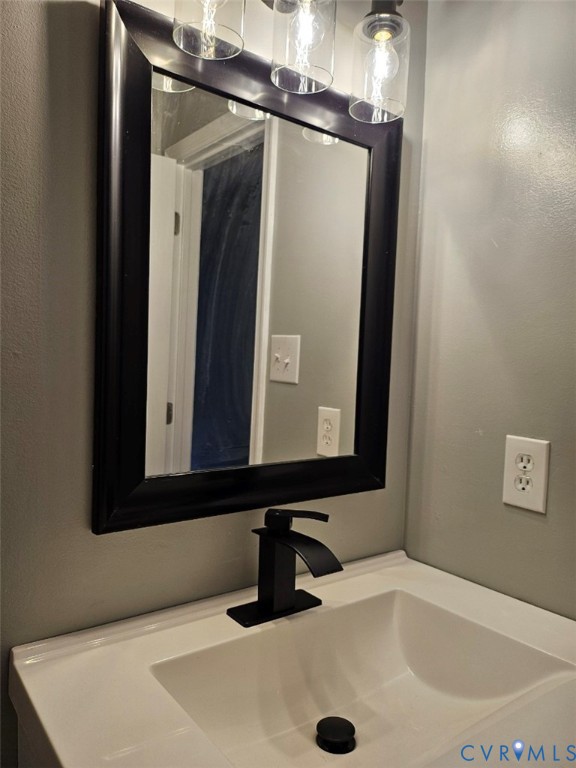 13607 Danwoods Road Midlothian, VA 23113 - Photo 15 of 19 a bathroom with a sink and a mirror