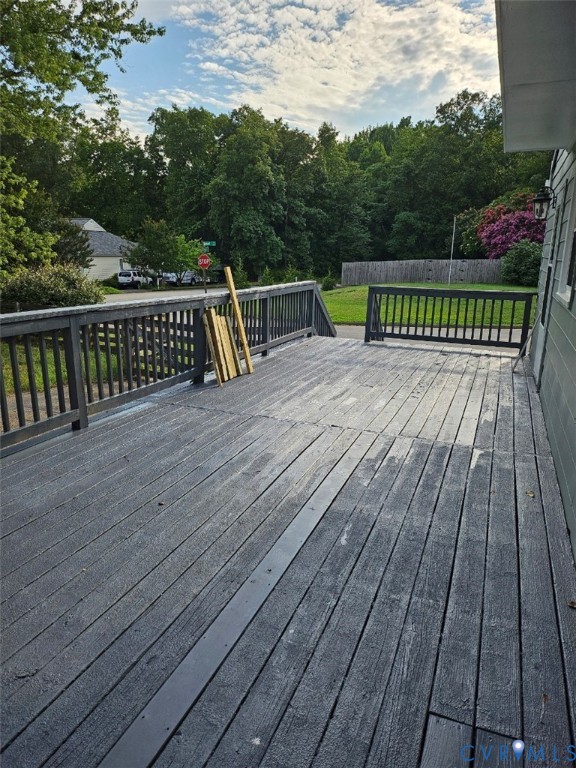 13607 Danwoods Road Midlothian, VA 23113 - Photo 18 of 19 a view of wooden deck with a bench
