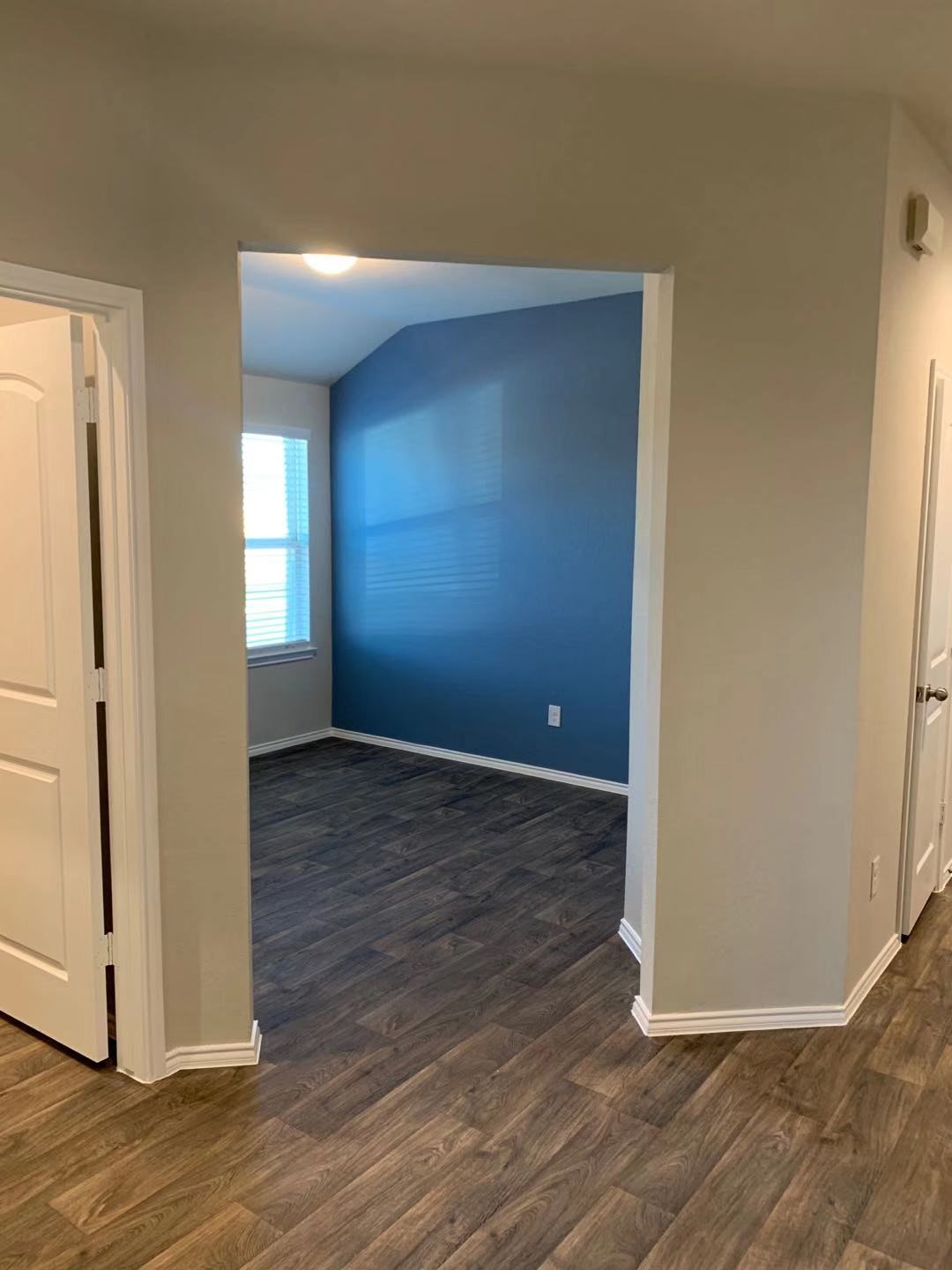 22730 Busalla Trail Katy, TX 77449 - Photo 3 of 10 a view of a hallway with wooden floor