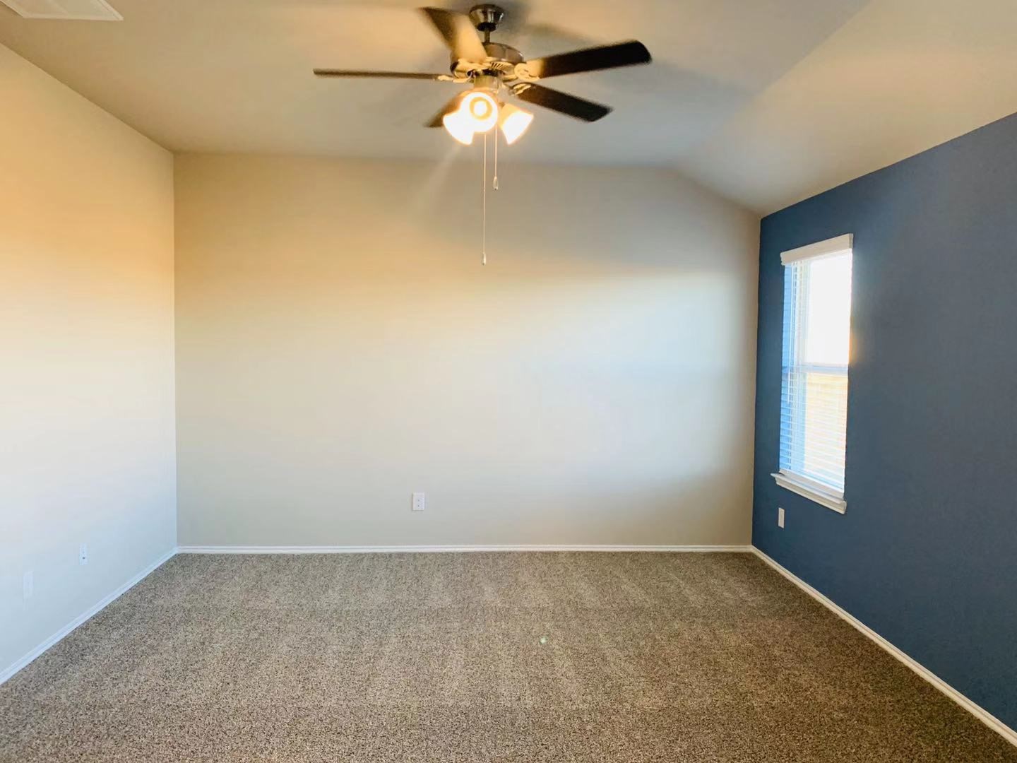 22730 Busalla Trail Katy, TX 77449 - Photo 5 of 10 an empty room with a window and a fan
