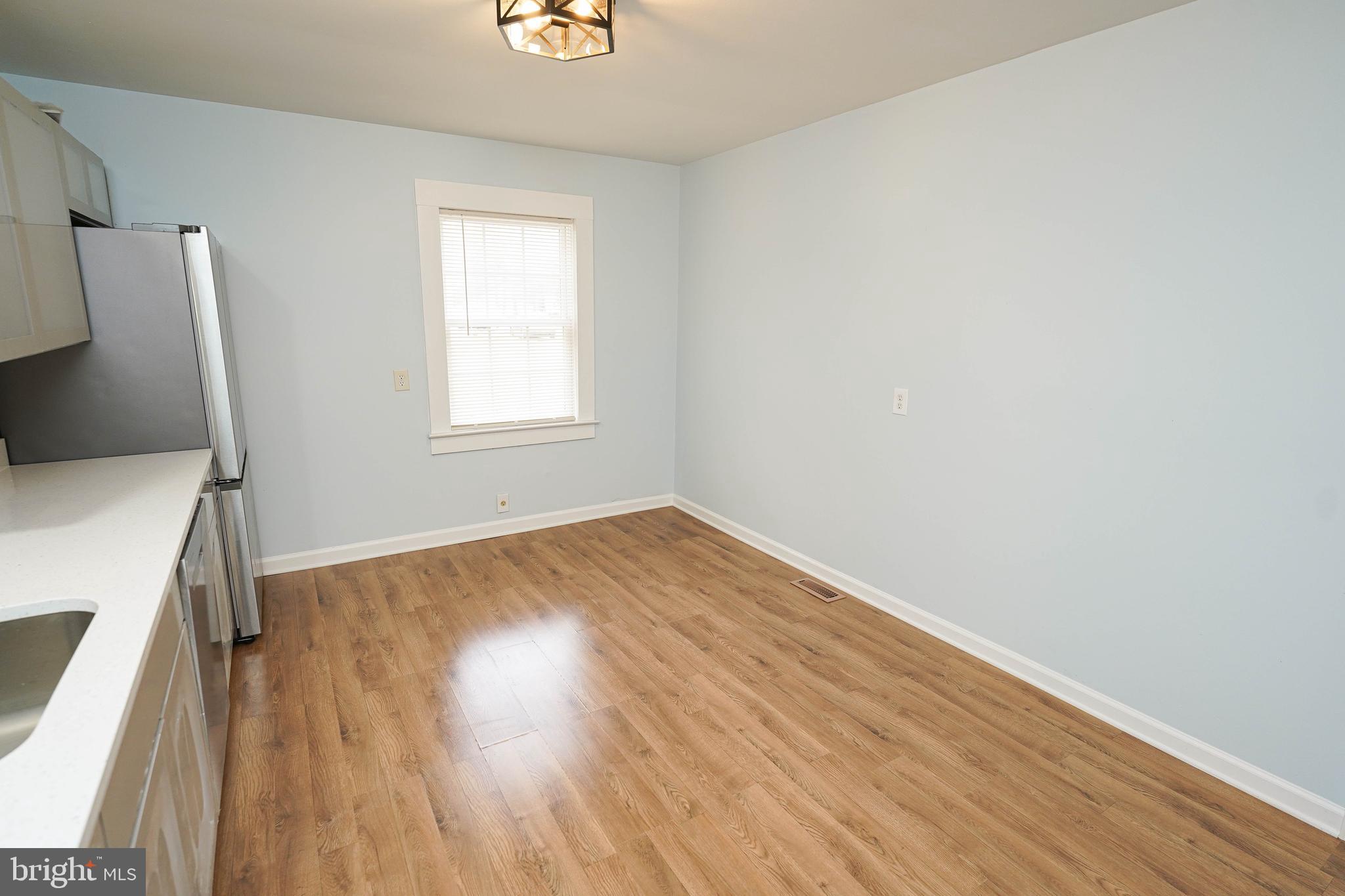 28144 Stanford Road Eden, MD 21822 - Photo 9 of 31 a view of empty room with wooden floor and fan