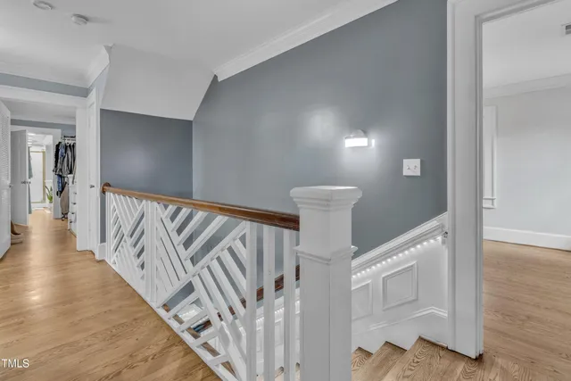 a spacious bathroom with a granite countertop sink a mirror and shower