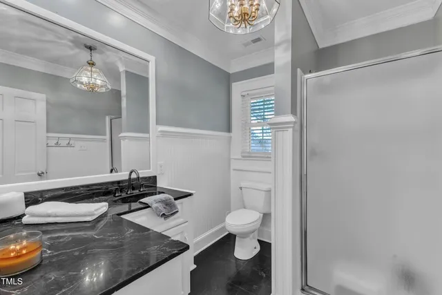 a view of a patio with couches and wooden fence