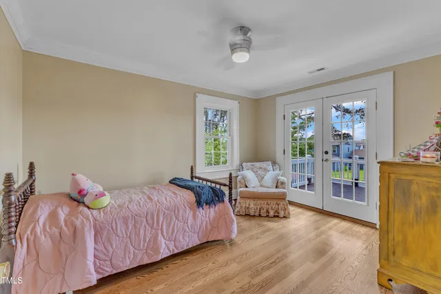a view of a patio with table and chairs and potted plants