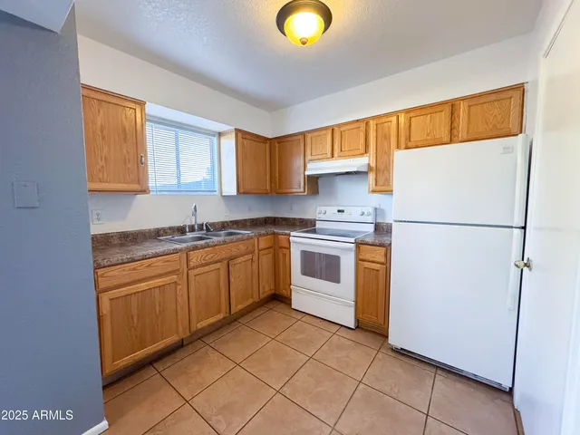 a picture of a building with a bench