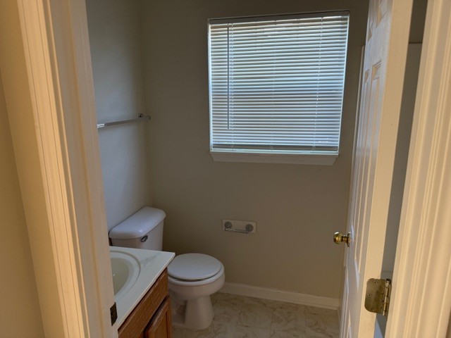 2004 Upland Drive Franklin, TN 37067 - Photo 11 of 11 a white toilet sitting next to a bathroom sink
