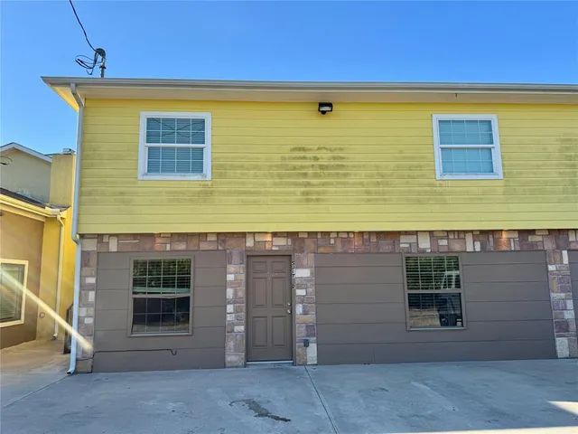a view of a brick house with a door
