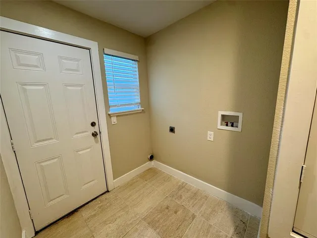 a bathroom with a granite countertop sink a toilet a mirror and shower