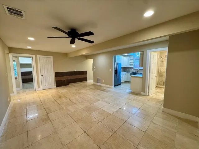 a view of a livingroom with a furniture and a ceiling fan