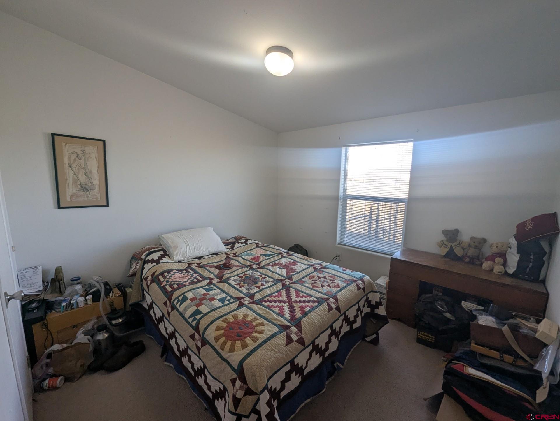 1119 2100th Road Delta, CO 81416 - Photo 9 of 9 a bedroom with a bed and a window