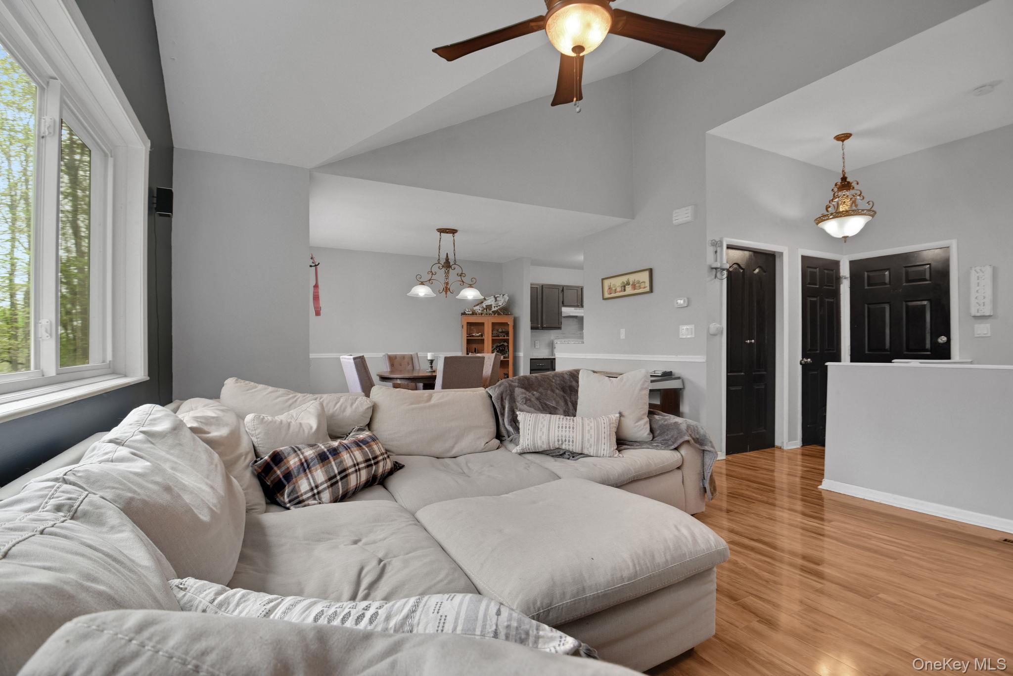805 Eagles Ridge Road Brewster, NY 10509 - Photo 5 of 22 a living room with furniture and a chandelier