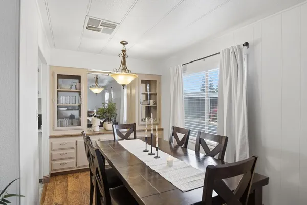 a view of a dining room with furniture window and outside view