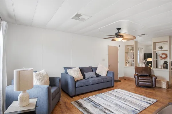 a living room with furniture and a rug
