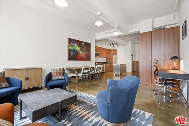 a living room with furniture and a table