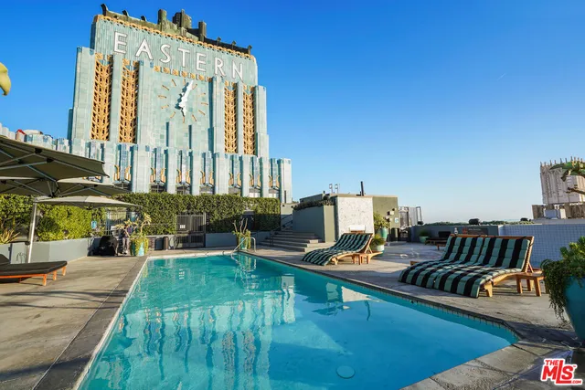 a view of balcony with outdoor seating and city view