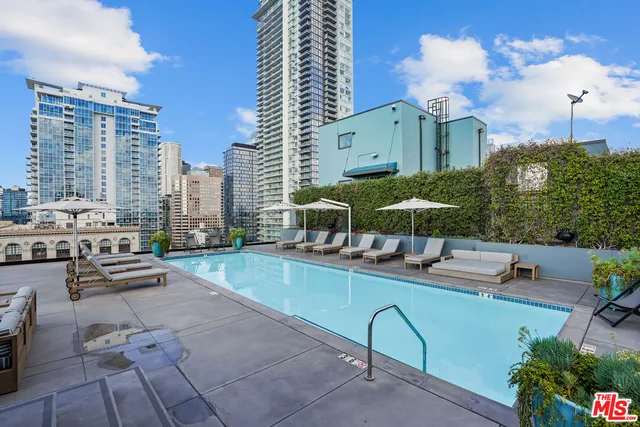 a view of a lake with a city skyline in the background