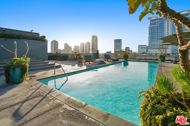a view of a backyard with sitting area
