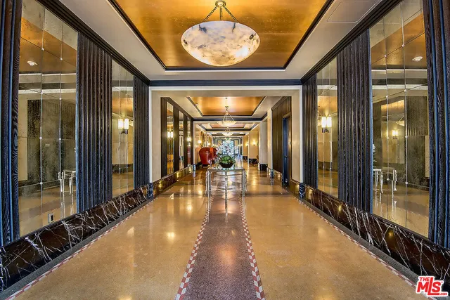 a lobby with furniture and window