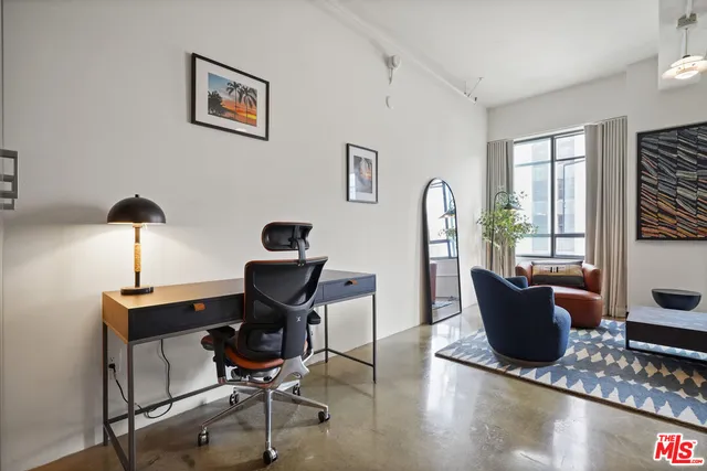 a work room with furniture and wooden floor