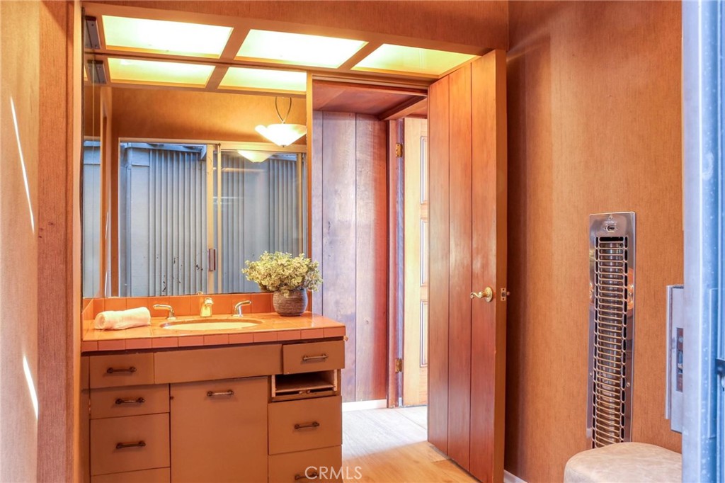 394 Pinecrest Drive Laguna Beach, CA 92651 - Photo 15 of 24 a bathroom with a sink a toilet and shower