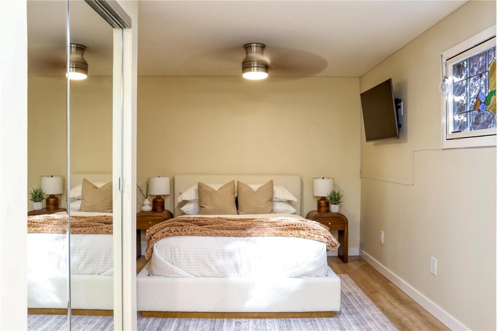 394 Pinecrest Drive Laguna Beach, CA 92651 - Photo 20 of 24 a bed sitting in a bedroom next to a window