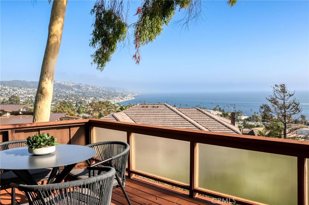 394 Pinecrest Drive Laguna Beach, CA 92651 - Photo 22 of 24 a view of a balcony with furniture and a potted plant