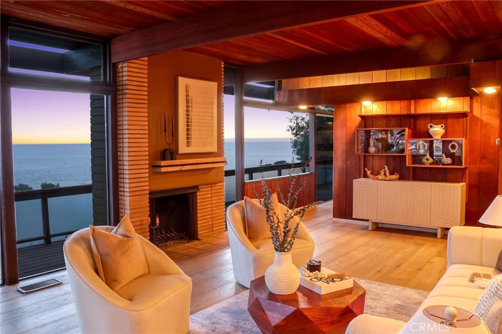 394 Pinecrest Drive Laguna Beach, CA 92651 - Photo 7 of 24 a living room with furniture and a fireplace