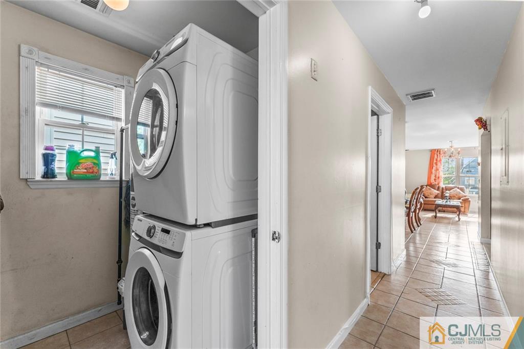 381 Prospect Street Perth Amboy, NJ 08861 - Photo 24 of 51 a view of a storage & utility room with washer and dryer