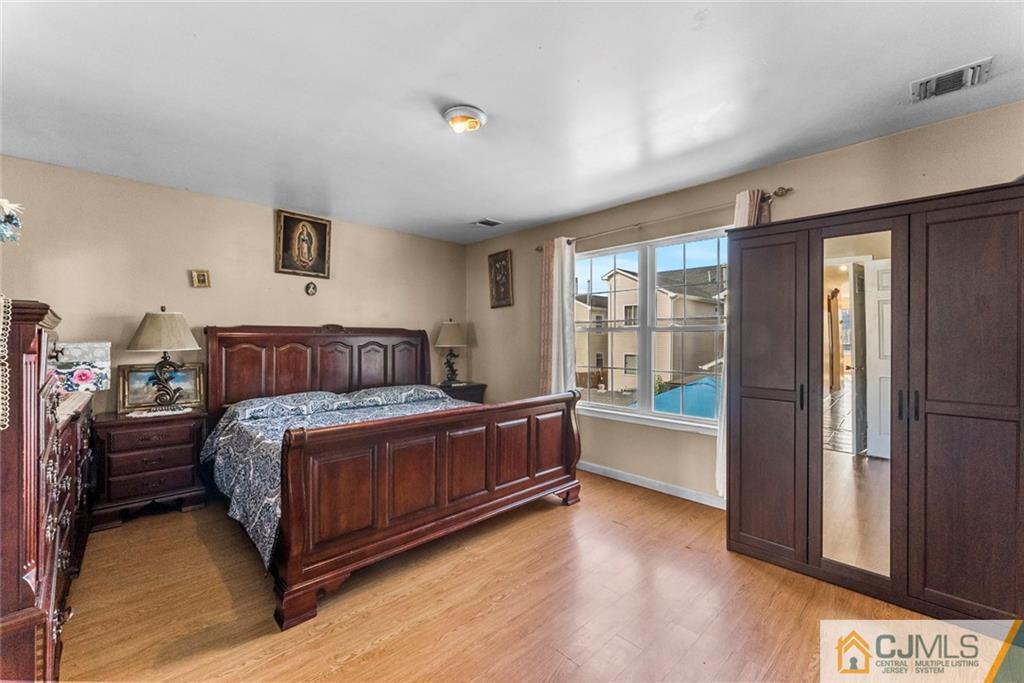 381 Prospect Street Perth Amboy, NJ 08861 - Photo 25 of 51 a bed room with a bed and a window