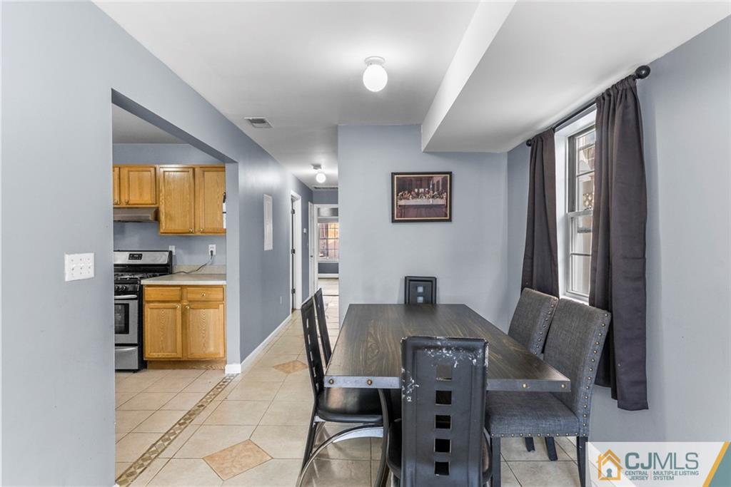 381 Prospect Street Perth Amboy, NJ 08861 - Photo 33 of 51 a view of a dining room with furniture and a window